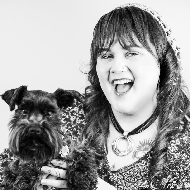Black and white photo of a woman with a dog